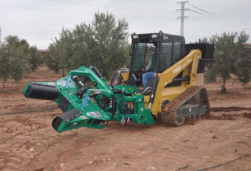 Vibrator with PG-2 Picker hitched to vehicle with farmer driving to vibrate olive trees